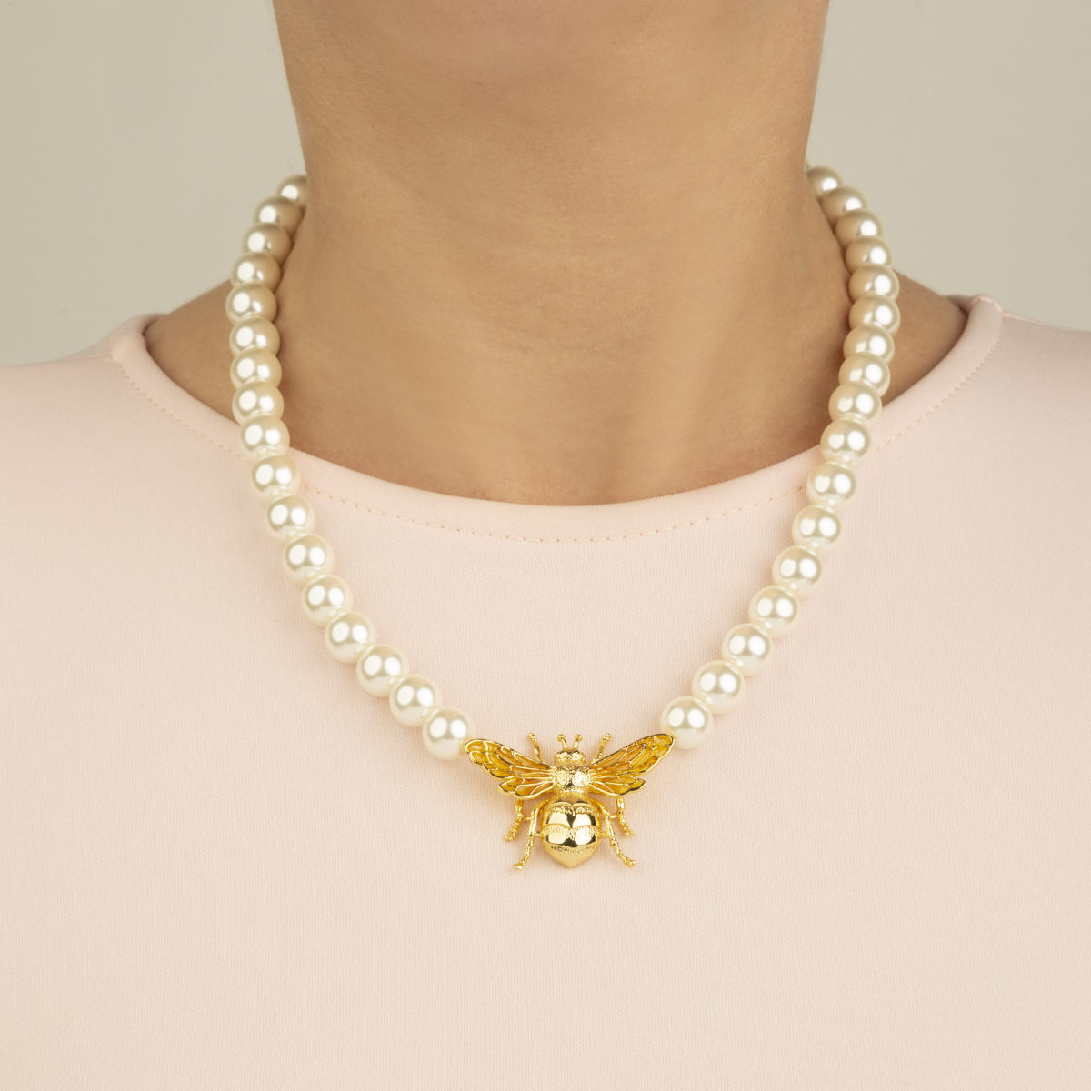 pearl necklace with bee pendant